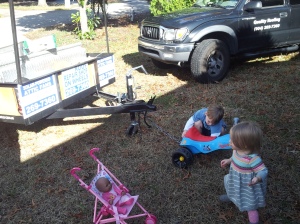 Justus LOVES trains and trying attach toys together that weren't meant to be attached. This is him trying to tow Papa's trailer with his tricycle.